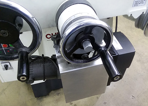 A rotary grinding table machine with a magnetized table top