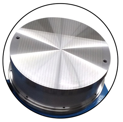 A CNC rotary grinding table shown with a magnetic table top